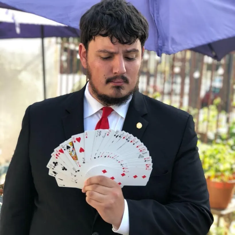 Tyler Sass, The Wizard, fanning a deck of cards
